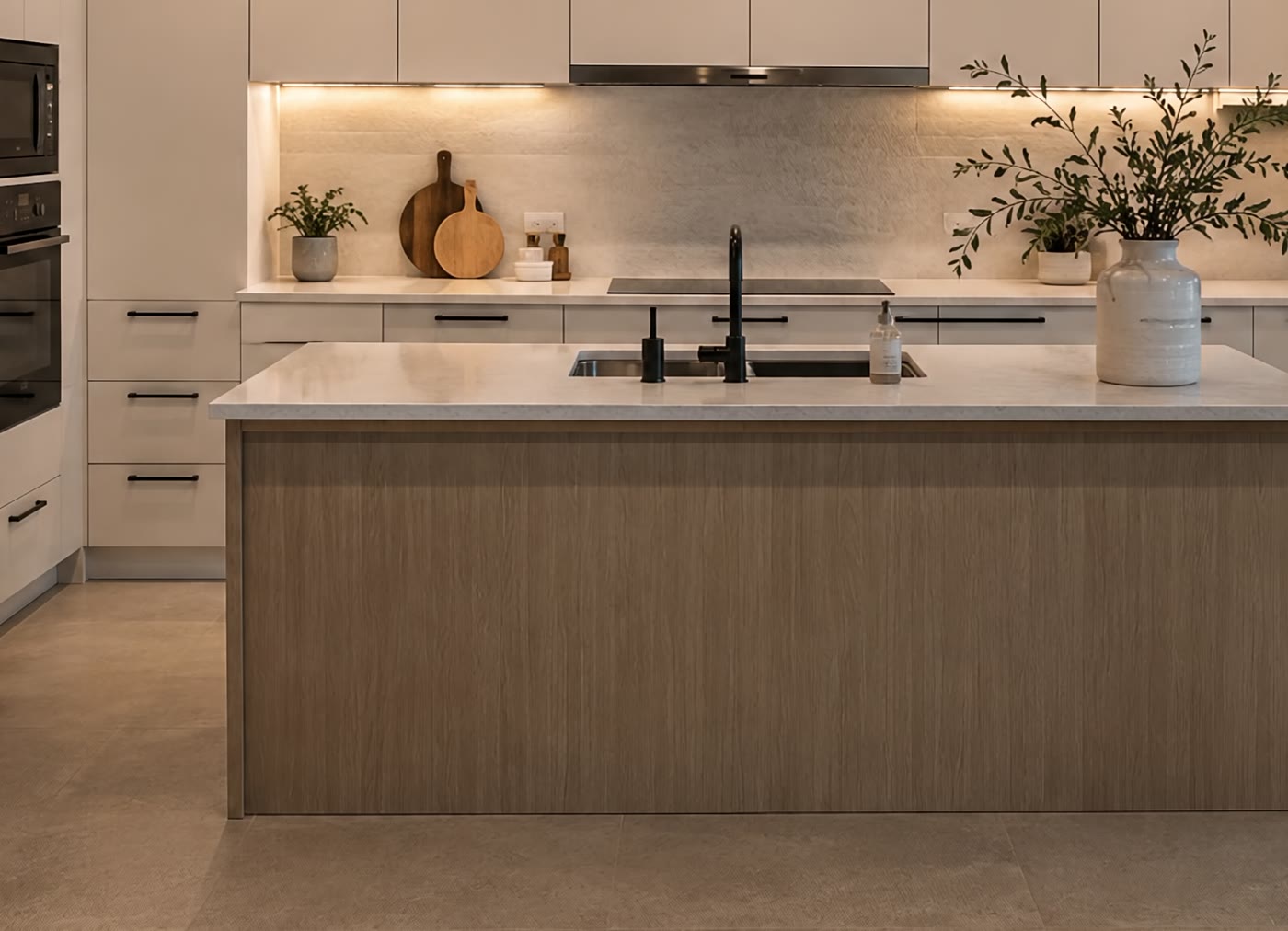 Pale oak kitchen island with stone worktop