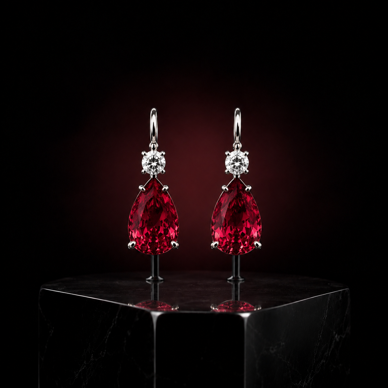 Passion — pear-cut ruby drop earrings beneath white brilliants
