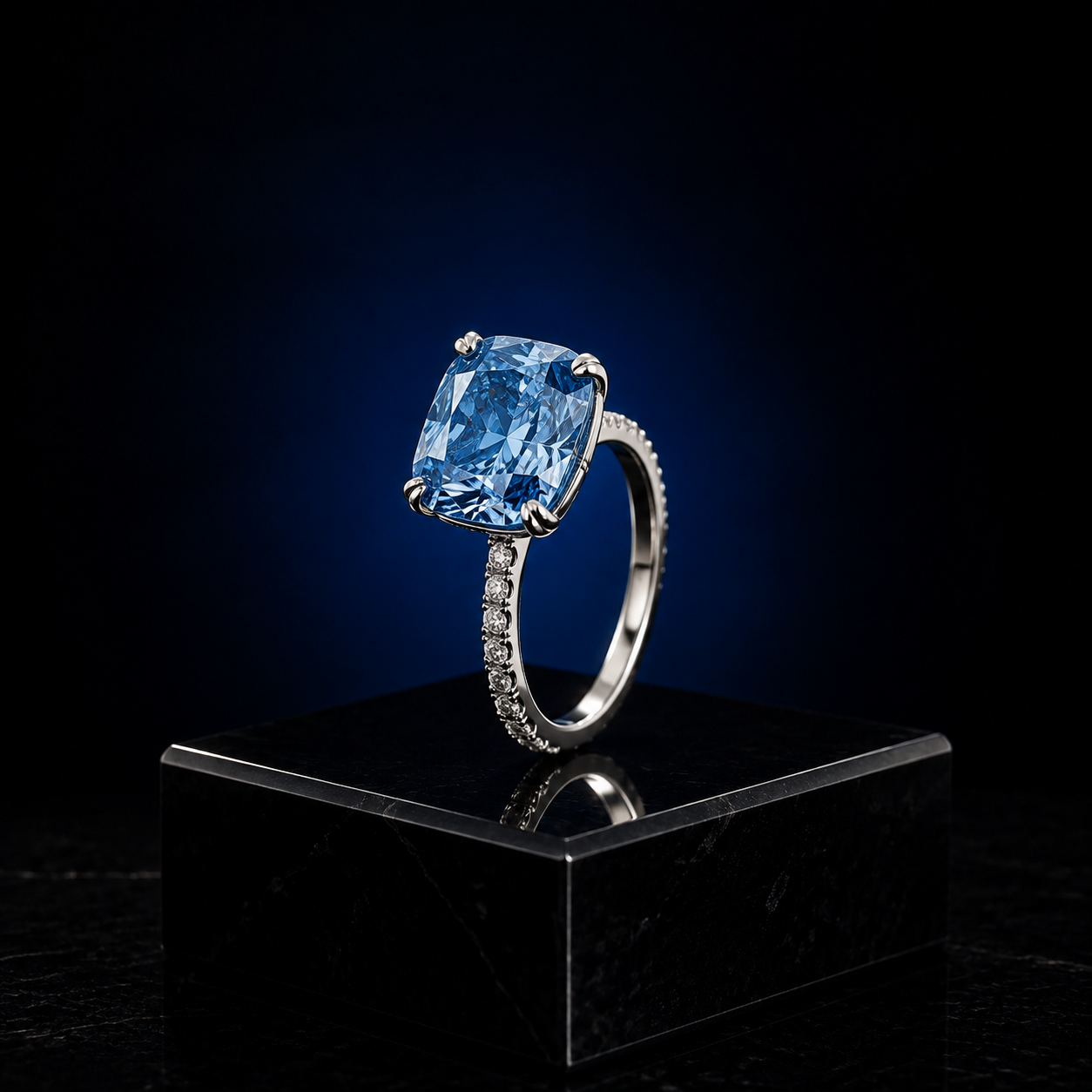 Azur — cushion-cut blue diamond ring with pavé band in platinum