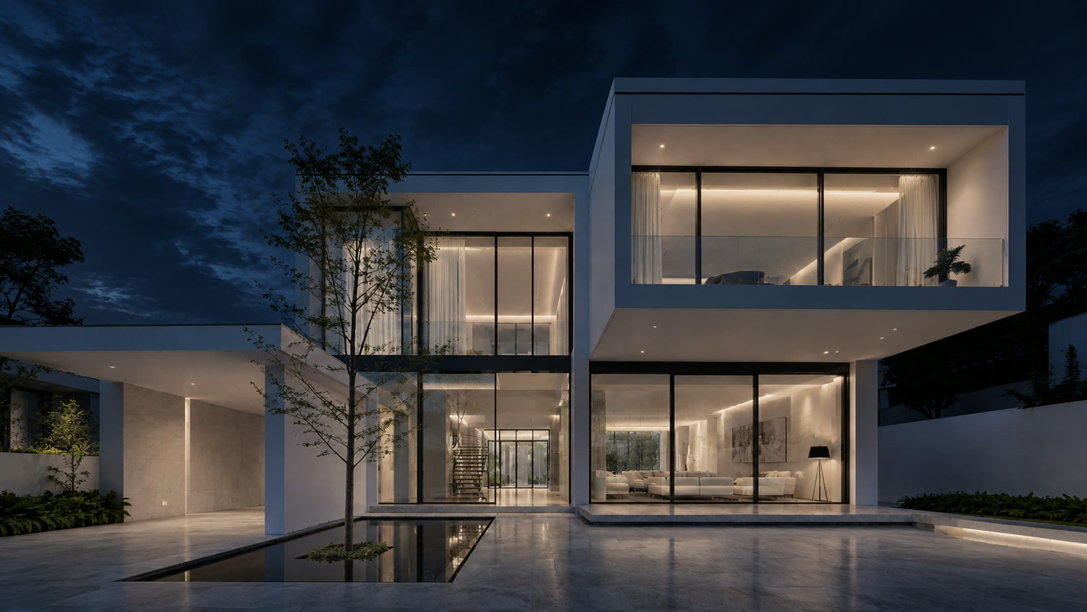 LUME house at night, interiors glowing warm behind glass