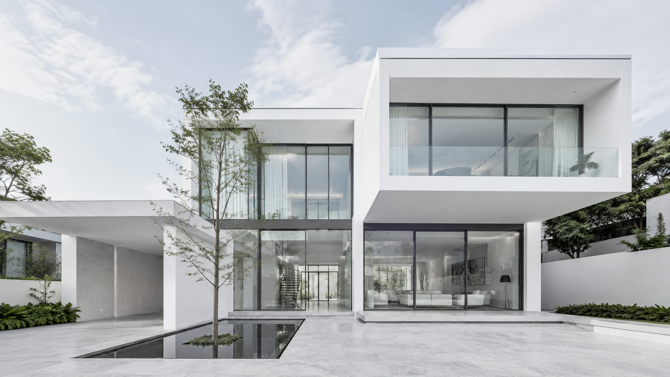 LUME house at midday, white volumes and glass around a still pool