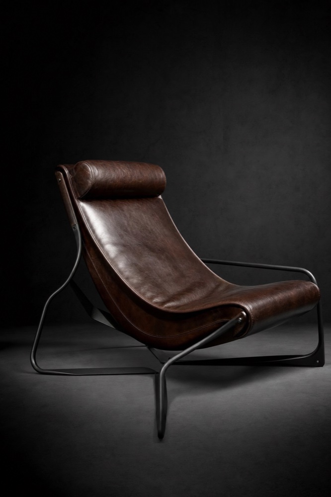 Sculptural lounge chair in chocolate leather and black steel