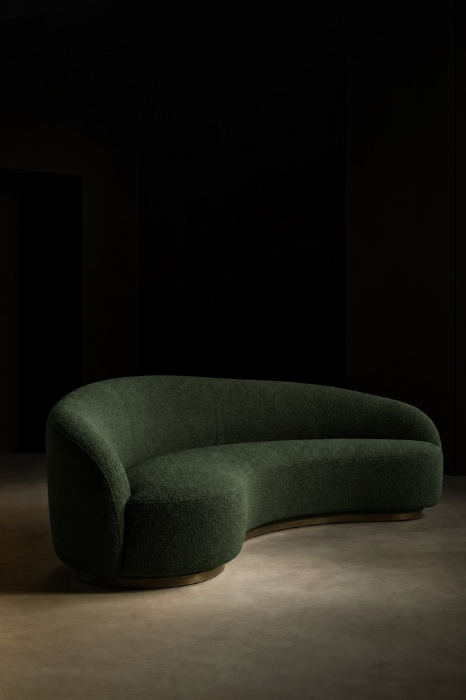 Curved boucle sofa in deep forest green