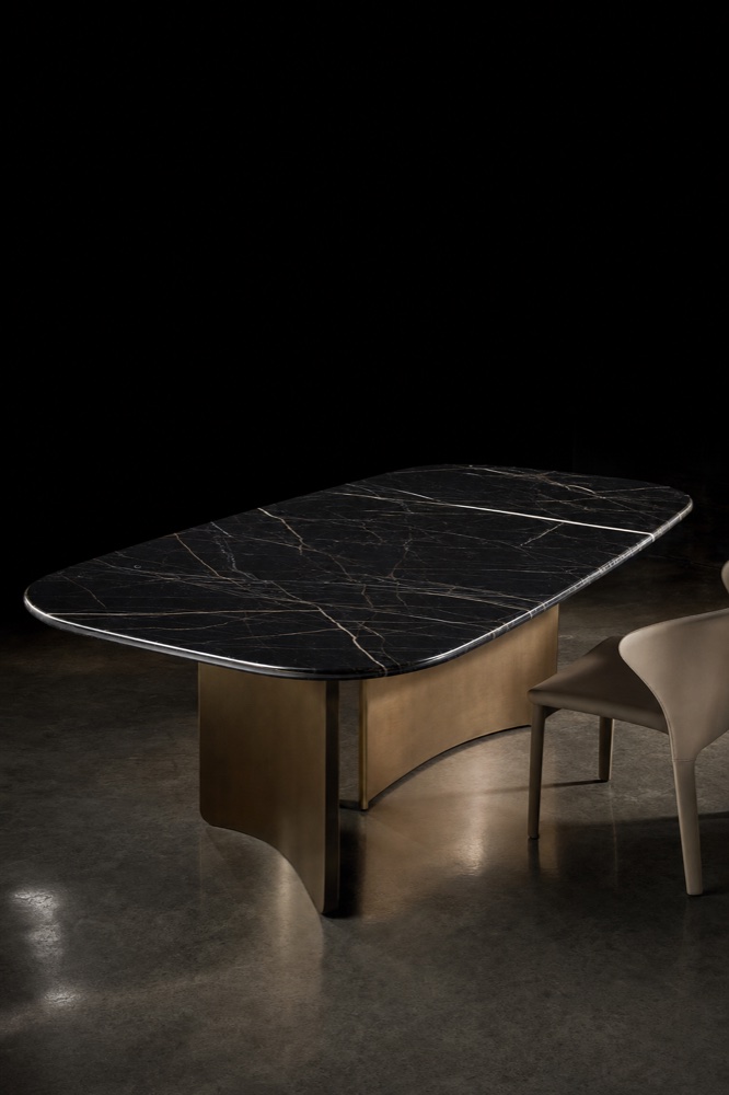 Black marble dining table with brass base