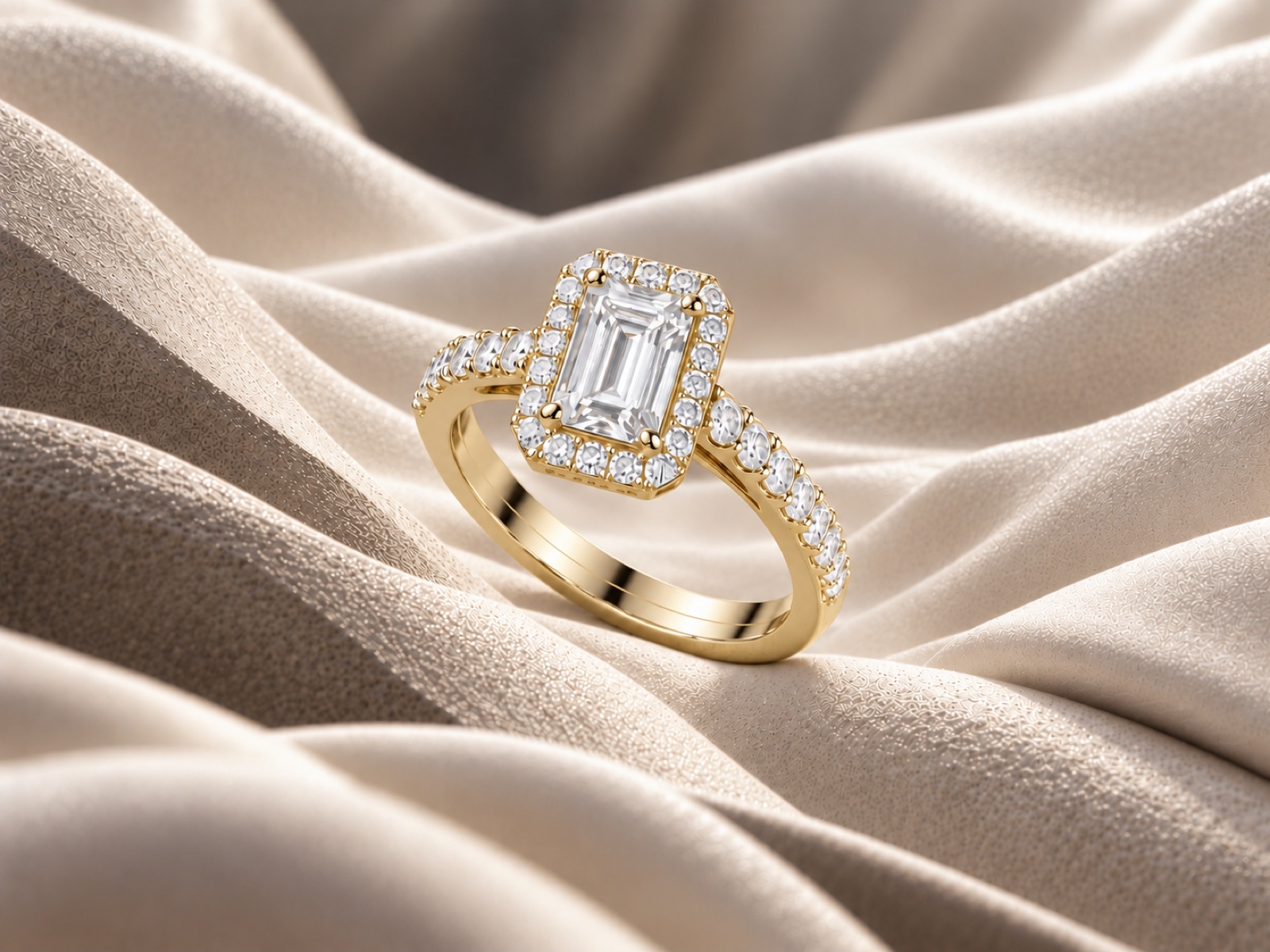 Emerald cut diamond with a halo on a gold band